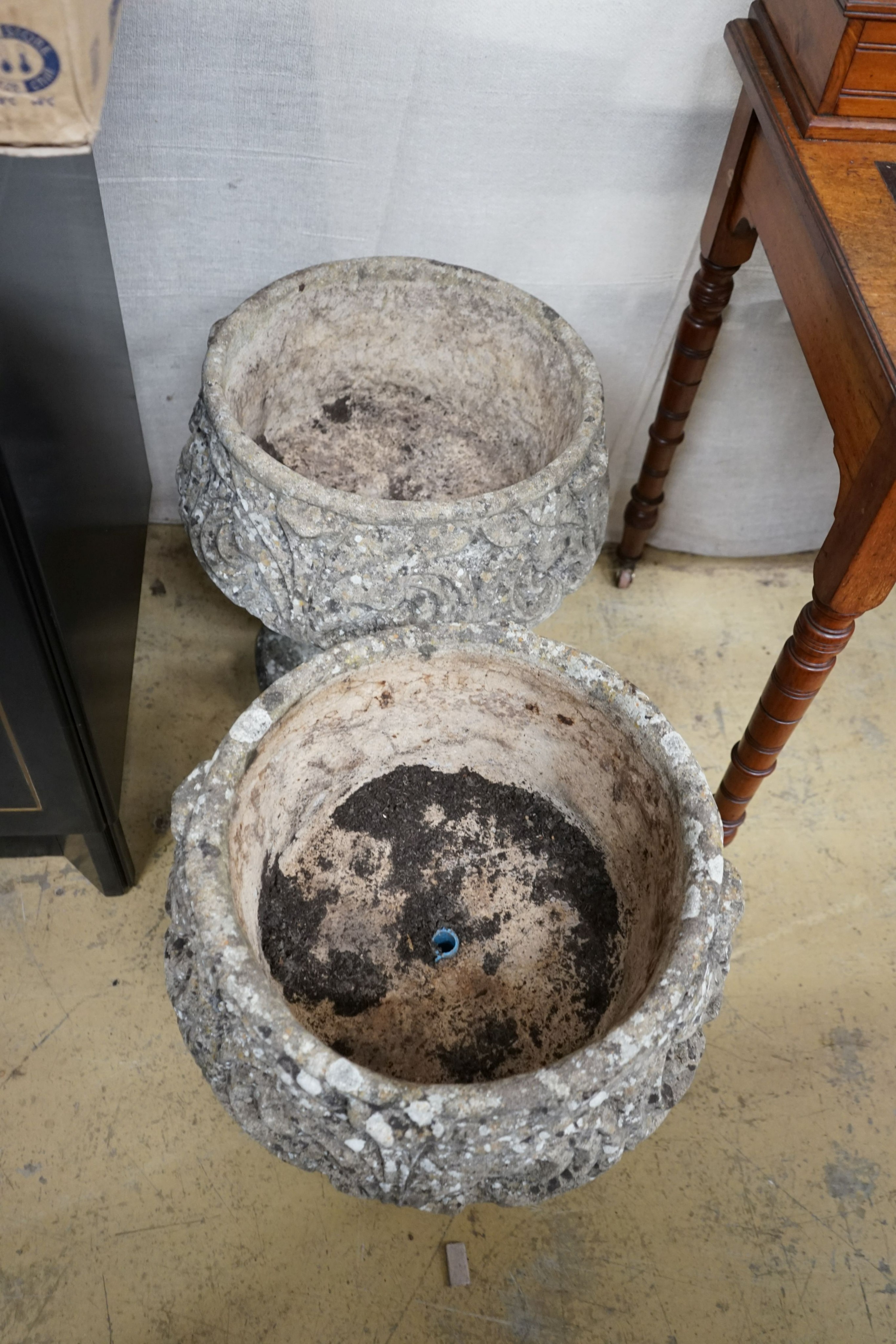 A pair of reconstituted stone circular garden planters, diameter 45cm, height 48cm